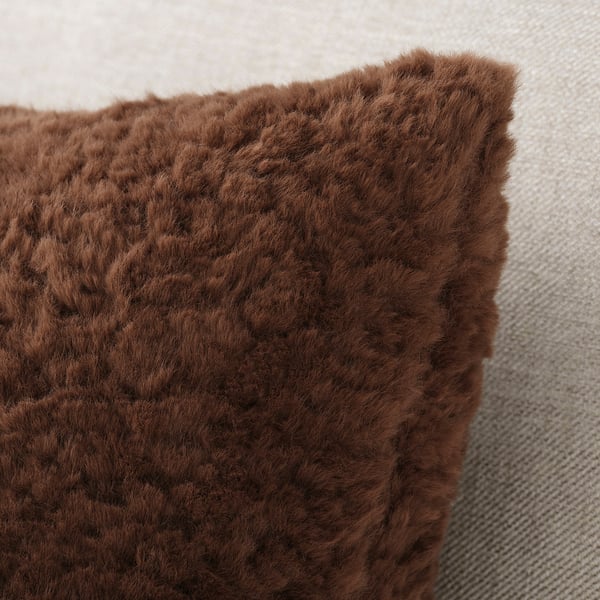 Close-up of soft, textured brown cushion cover, likely made from eco-friendly materials.