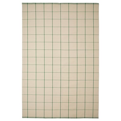 The RIDSTIG beige and green striped rug. It is rectangular with a flat-woven surface, perfect for dining areas and easy to clean.