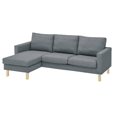Modern grey l-shaped couch with wooden legs.