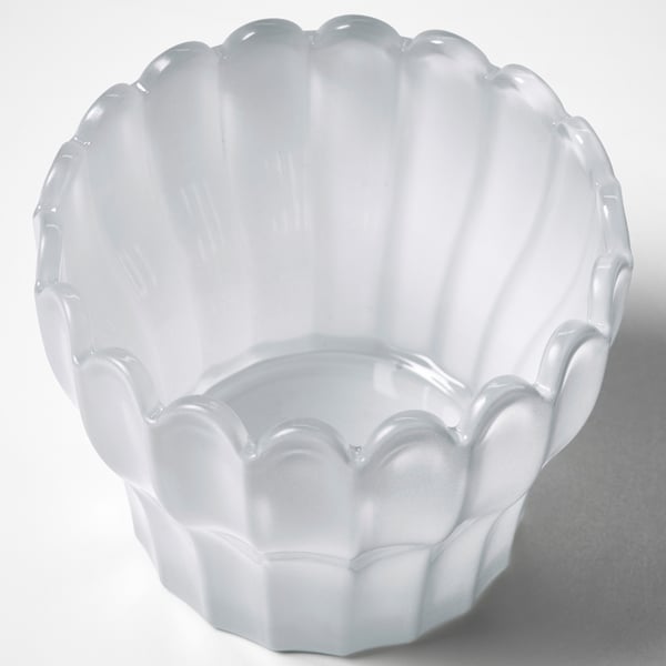 Elegant white glass bowl with scalloped edges. Crafted for quality, showcasing intricate petal design.