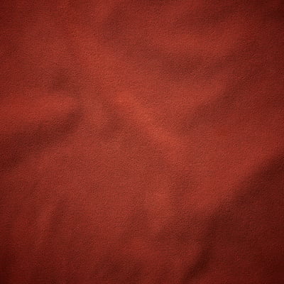 Soft, luxurious red velvet texture, rich detail, inviting comfort.