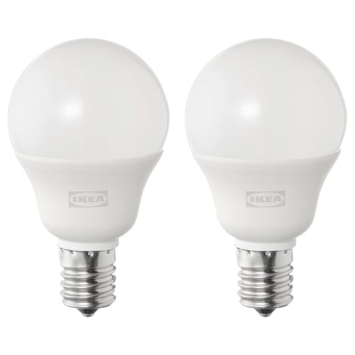 Two ikea SOLHETTA led bulbs, white, spherical shape, stand upright, metallic base, frosted dome cover.