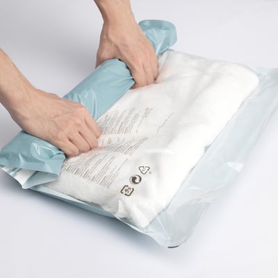 Two clear zip-lock bags with labels, likely storage bags with instructions and warnings in english, french, and italian.