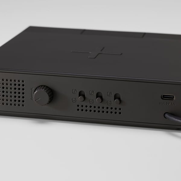 Black modern alarm clock, sleek design with digital display, control buttons, and usb port.