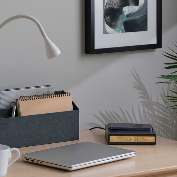 Minimalist workspace with STENGRÖNSKA alarm clock, laptop, organiser, mug, plant, and lamp.