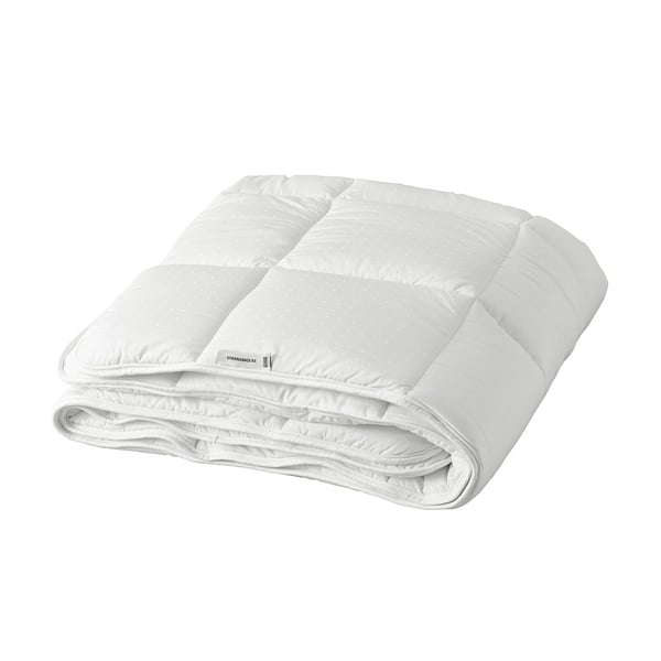 Folded white STRANDMOLKE duvet, extra warm, lightweight, with soft cotton and recycled polyester hollow fibre filling, neatly stitched, luxury design.