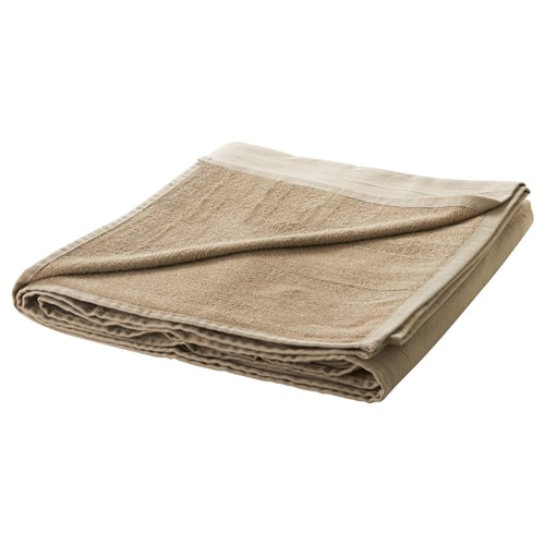 Folded beige cotton duvet. Neatly arranged with simple design.