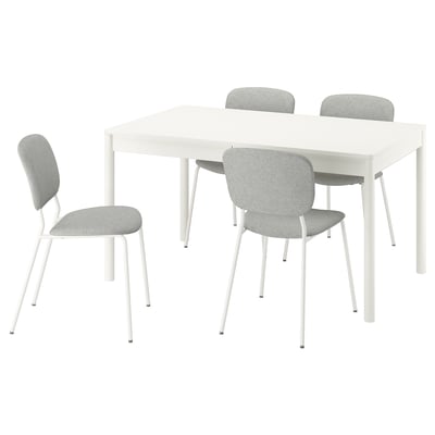 Extendable table and four upholstered chairs, modern design.