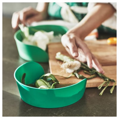 Three colourful bowls, green and orange, stackable, made of polystyrene plastic, designed for food prep.