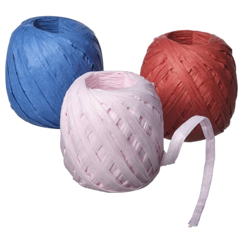 Three spherical paper decorations in blue, white, and red colours.