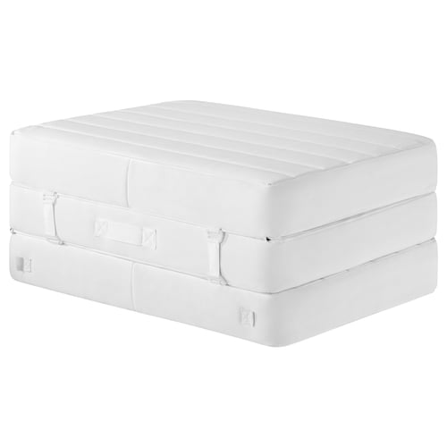 A VITHÄLL white sofa bed, featuring a padded top with zip, buckles, and foam support.