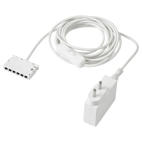 A white ANSLUTA power cord with a 6-way adapter and a power plug, designed for controlling multiple lights with a single switch.