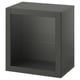A black ikea BESTÅ storage unit with a glass shelf and glass door. The modern design is square-shaped and sleek.