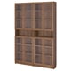 A BILLY bookcase with glass doors. It oak-colored wood and six glass-fronted compartments.