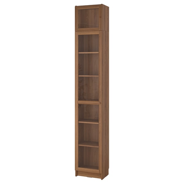 A tall BILLY bookcase in a warm brown colour, featuring multiple adjustable shelves and a wooden finish.