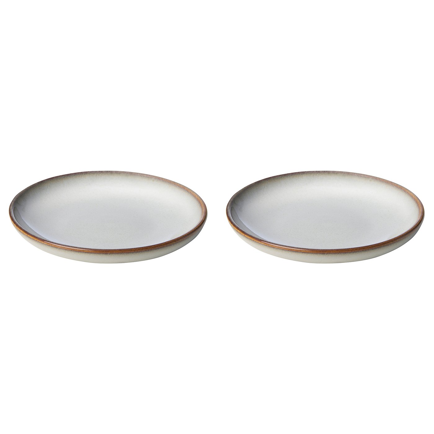 Two round, light beige stoneware side plates with a textured glaze and simple, elegant design, perfect for various dishes.
