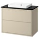 A beige HAVBÄCK bathroom vanity with a square white basin. It two drawers and a black countertop.