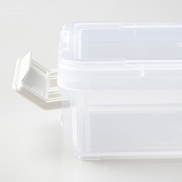 Clear stackable plastic box with a snap-on lid, featuring a white clip mechanism for secure closure.