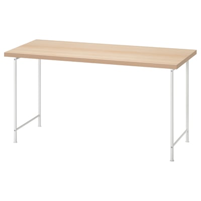 An IKEA LAGKAPTEN light wooden desk with white metal legs. The desk is rectangular with adjustable feet.