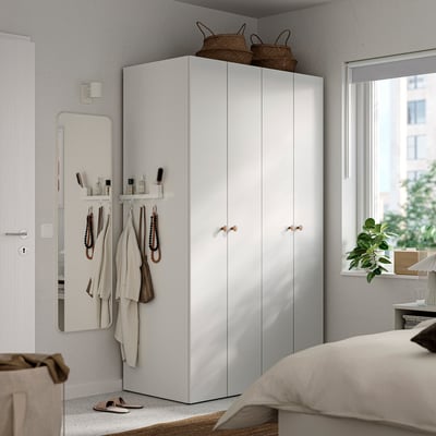Minimalist bedroom with large LASTARE wardrobe, three sections, two baskets.