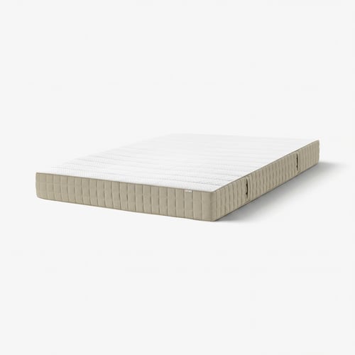A neutral-colored, rectangular MAUSUND mattress with linen and cotton cover, and natural fillings. Its designed for comfort and breathability.