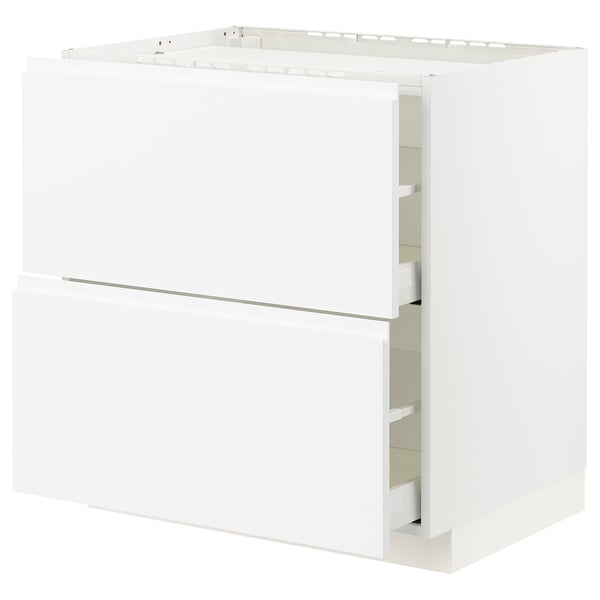 White METOD kitchen unit with minimalist design and integrated handles.