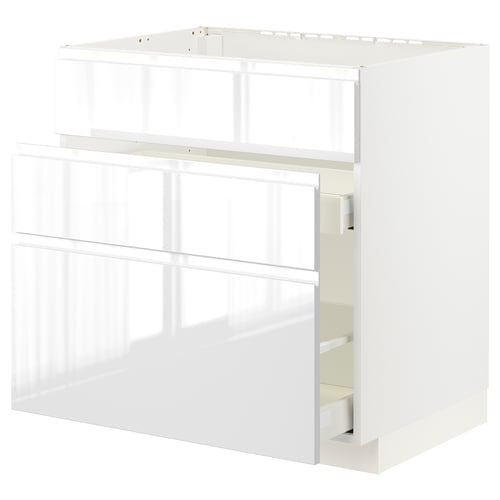 White METOD kitchen cabinet with high gloss finish and integrated handles.