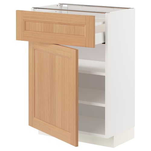 An ikea METOD kitchen cabinet with an oak door and adjustable shelves. It a natural, warm look with a sturdy design.
