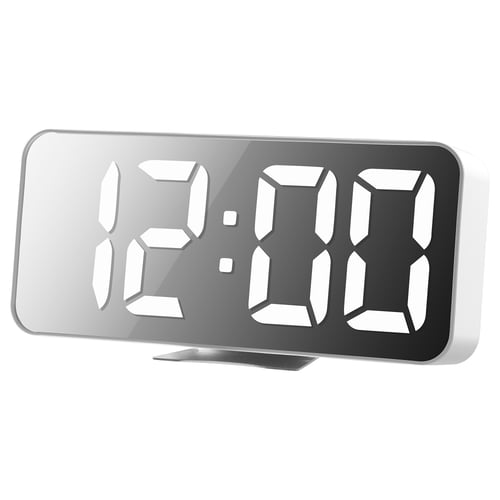A sleek white digital clock with large, illuminated numbers. It displays time or temperature. Modern design with adjustable brightness and usb power.