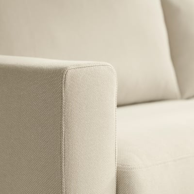 Close-up of SALTSJÖBADEN sofa, showcasing soft, textured fabric and plush cushioning.