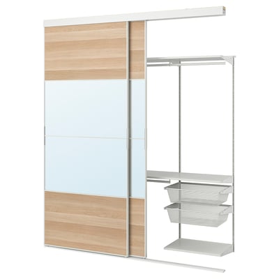 SKYTTA modular closet: light oak, mirrored glass, metal shelves & baskets, sliding door.