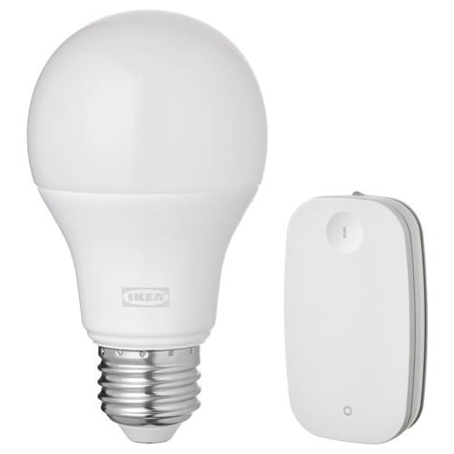 White ikea TRÅDFRI smart light bulb and remote, sleek design with smooth surfaces and rounded edges, wireless control capability.
