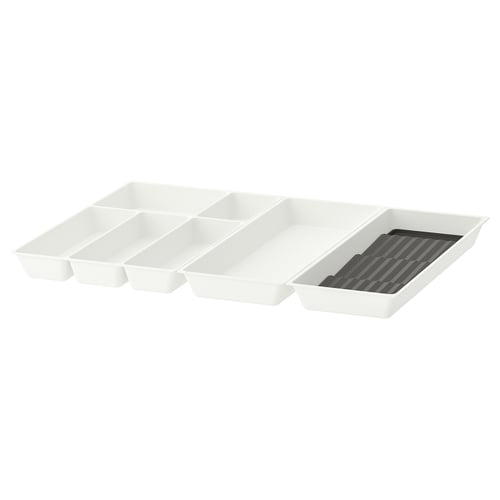 White plastic cutlery tray with compartments. Includes a separate spice rack. Organises kitchen utensils efficiently.