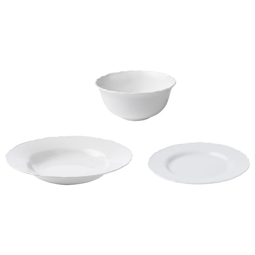 Three white porcelain dishes: two bowls and one plate, shaped with smooth edges and simple design.