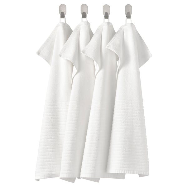 Four white, square, terry cotton hand towels hung neatly in a row.