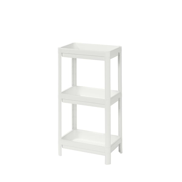A white VESKEN three-shelf organising unit made of polypropylene plastic. The shelves are rectangular with high edges to prevent items from falling.