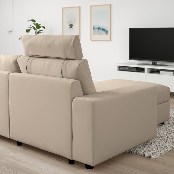 Modern VIMLE sofa with chaise, light beige, in minimalist living room. Tv in background, soft cushions, clean lines.