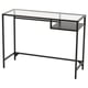A black VITTSJÖ desk with a glass top and metal frame. It has an open shelf for storage.