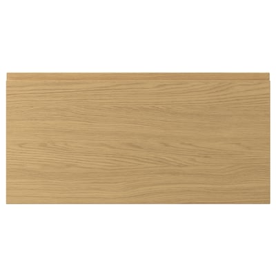 VOXTORP drawer front in oak colour with sleek, modern design and integrated handles.