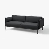 Modern charcoal sofa, minimalist design, metal legs, cushioned seating and back.