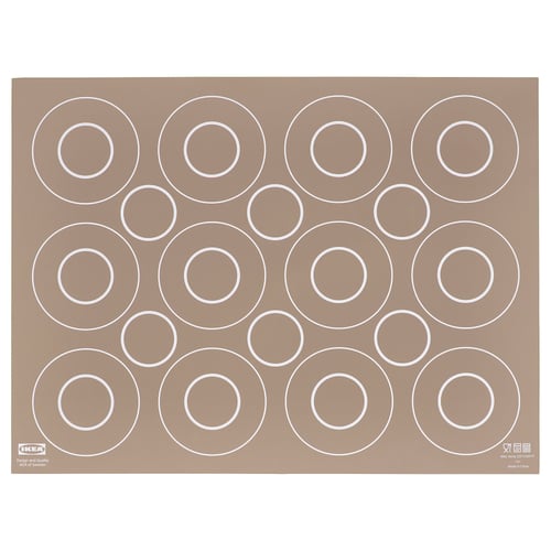Brown ikea BAKTRADITION silicone baking mat with large white circle cutouts for even baking.