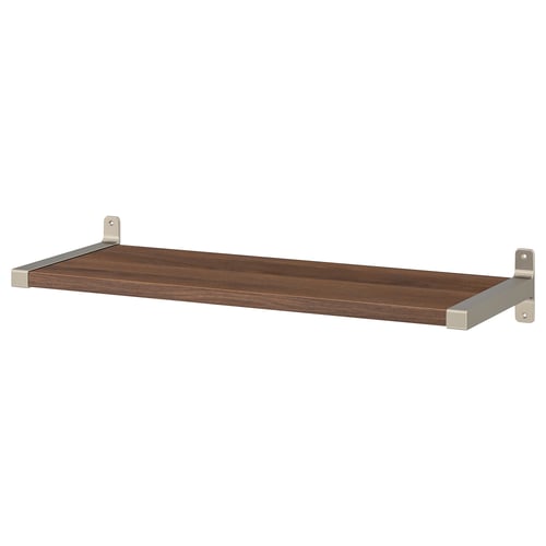 A BERGSHULT wall shelf, made of wood, with metallic brackets. It is rectangular, dark brown, and has a sleek, simple design.