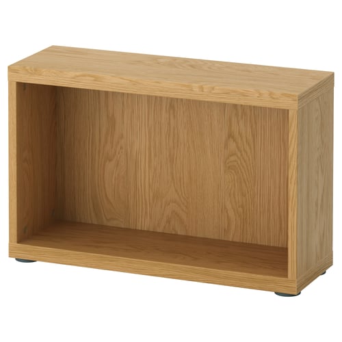 An IKEA BESTÅ wooden storage unit in light oak colour, featuring an open shelf design.