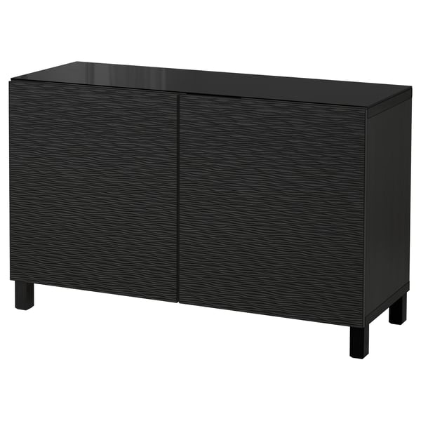 Black BESTÅ cabinet with textured doors and glass top.