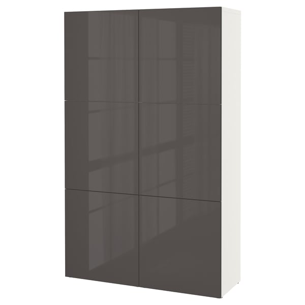 An IKEA BESTÅ storage unit in black with four doors. It has a sleek, modern design with a glossy finish.