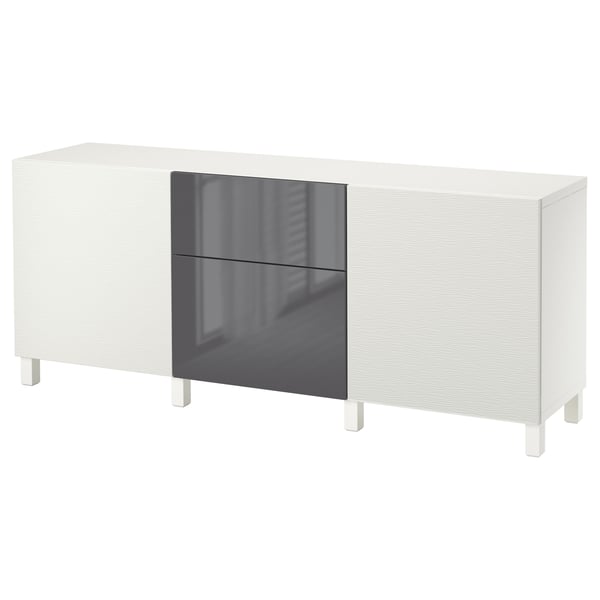 A white BESTÅ sideboard with a glossy grey door and drawers. Its rectangular with clean lines and raised on white legs.