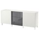A white BESTÅ sideboard with a glossy grey door and drawers. Its rectangular with clean lines and raised on white legs.