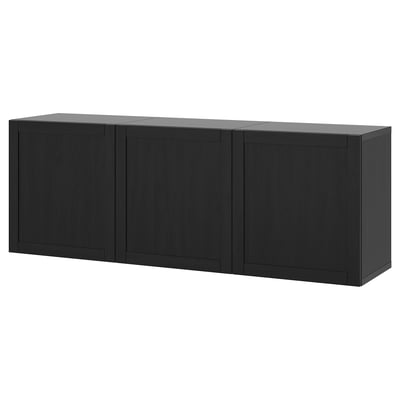 A black, wall-mounted BESTÅ storage cabinet combination with four doors. It offers practical storage and an airy feel.