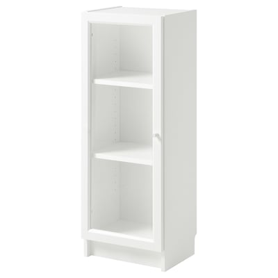 A white BILLY bookcase with glass doors, standing tall and slim, perfect for small spaces.