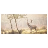 Foggy forest scene featuring majestic deer with large antlers, standing near bare tree, captured in muted earth tones.